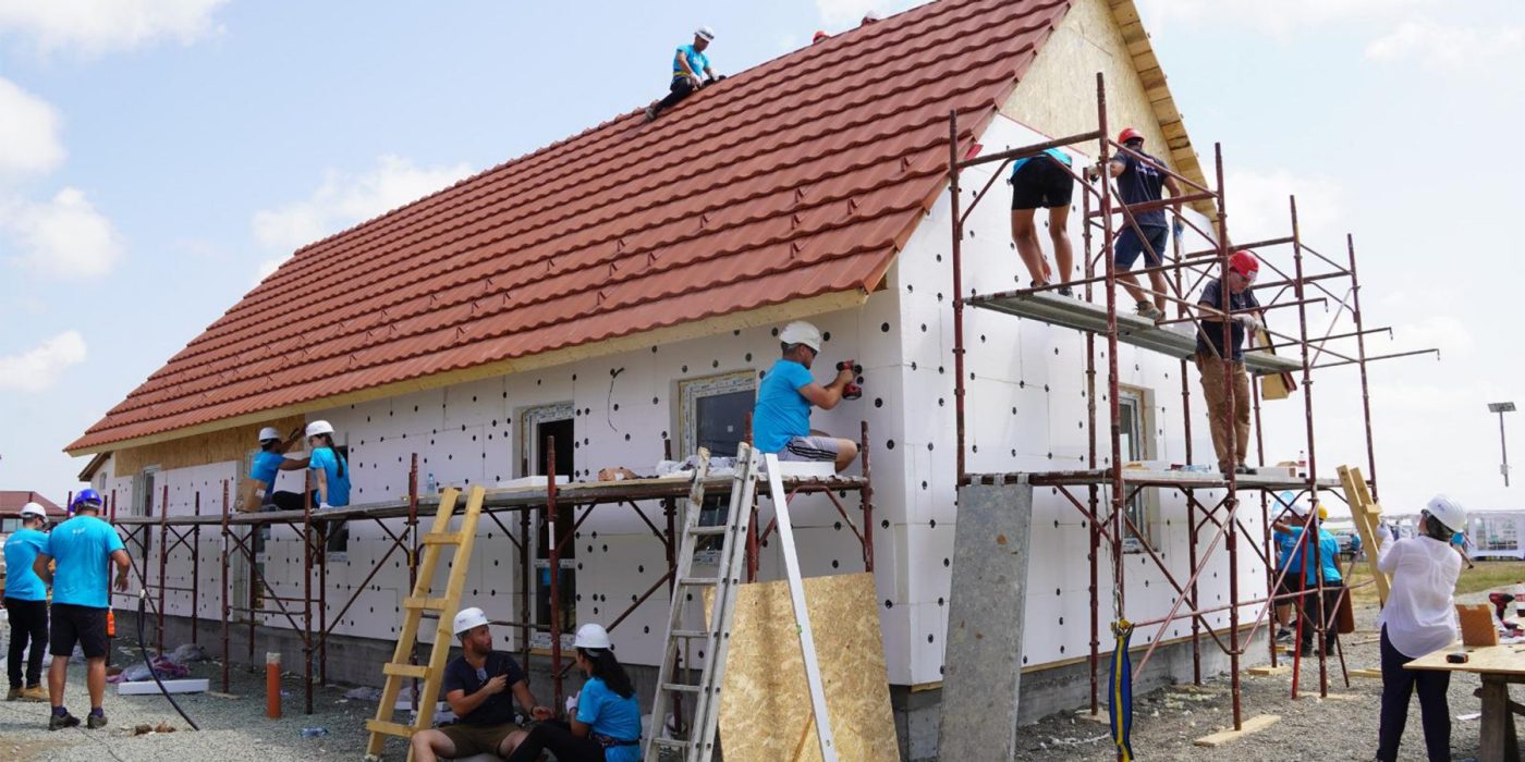 People building a house