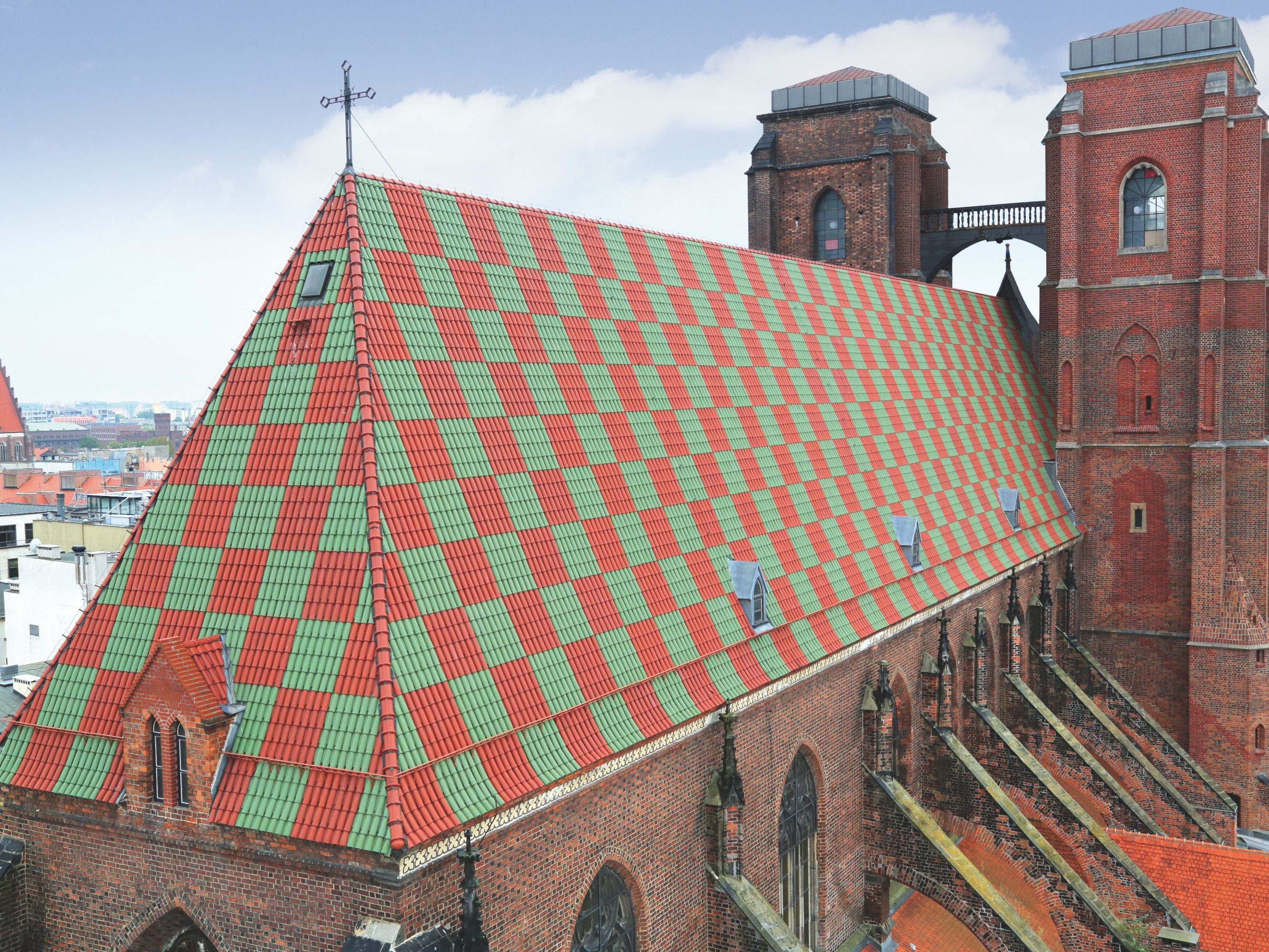 St Magdalene church Wroclaw Poland with monk nun roof tile