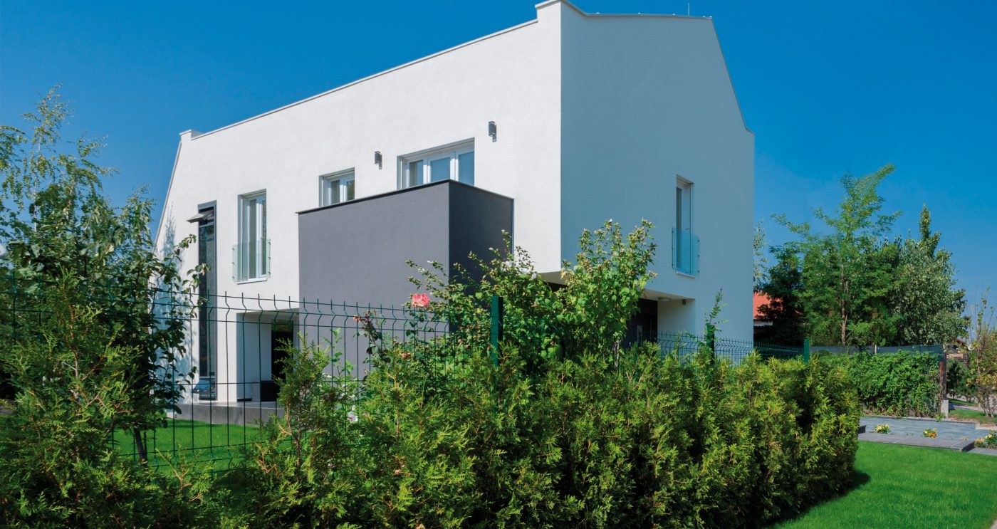 e4 house view from outside green fence