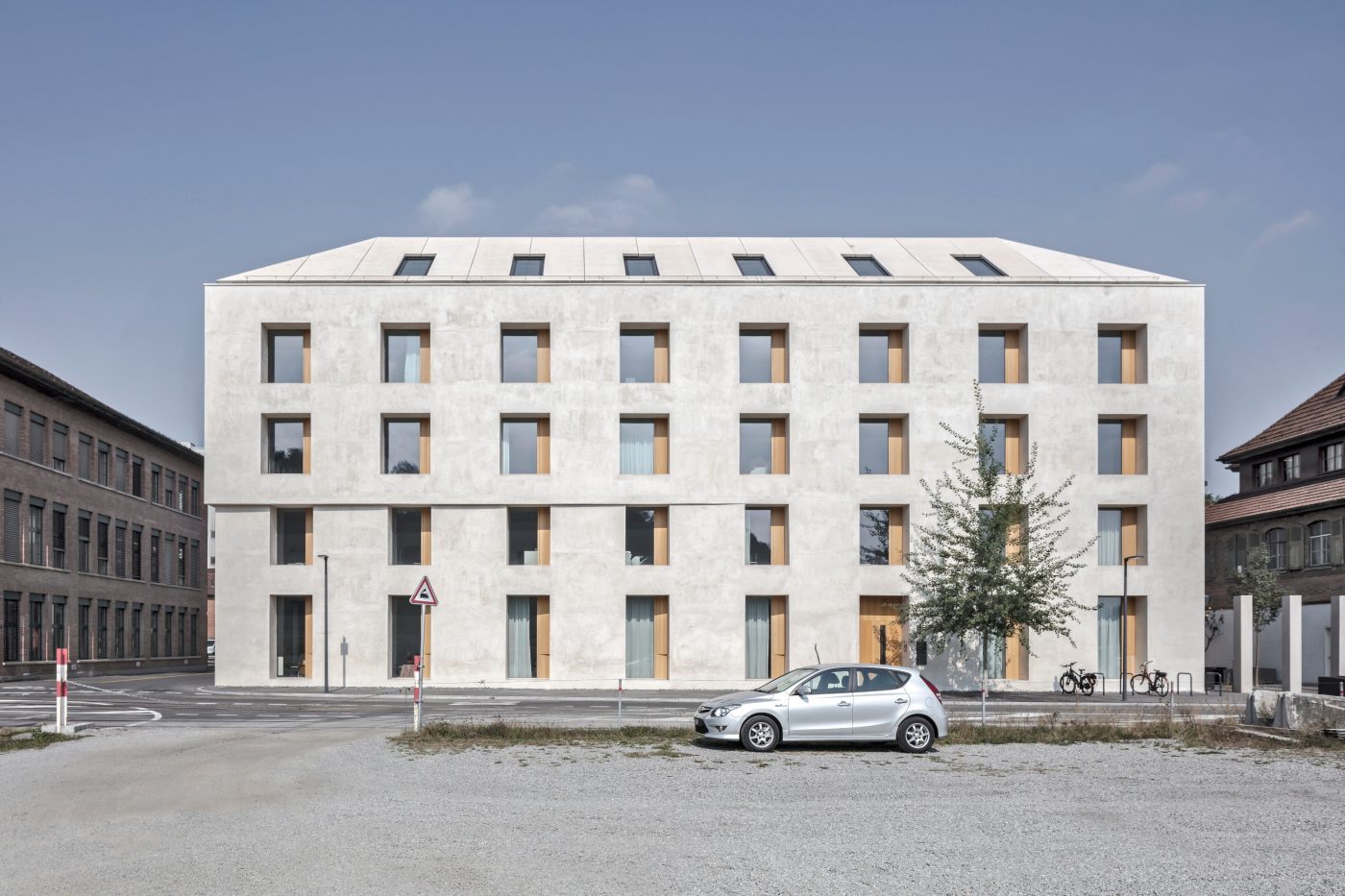 2226 Emmenweid. Brick Award 22 Category "Working together". Baumschlager Eberle Architekten. Photo of building from afar